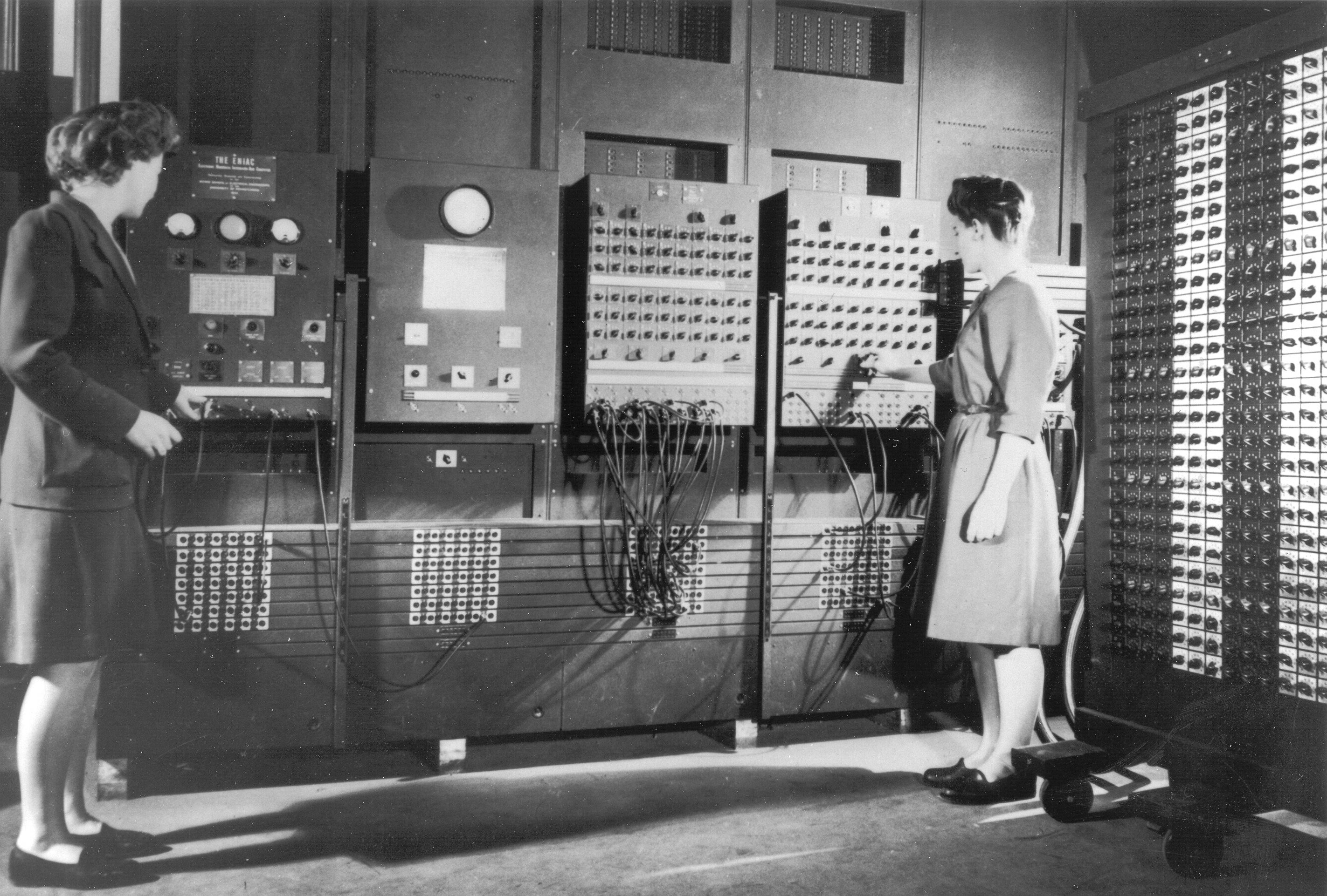 Programmers Betty Jean Jennings (left) and Fran Bilas (right) operate the main control panel of ENIAC